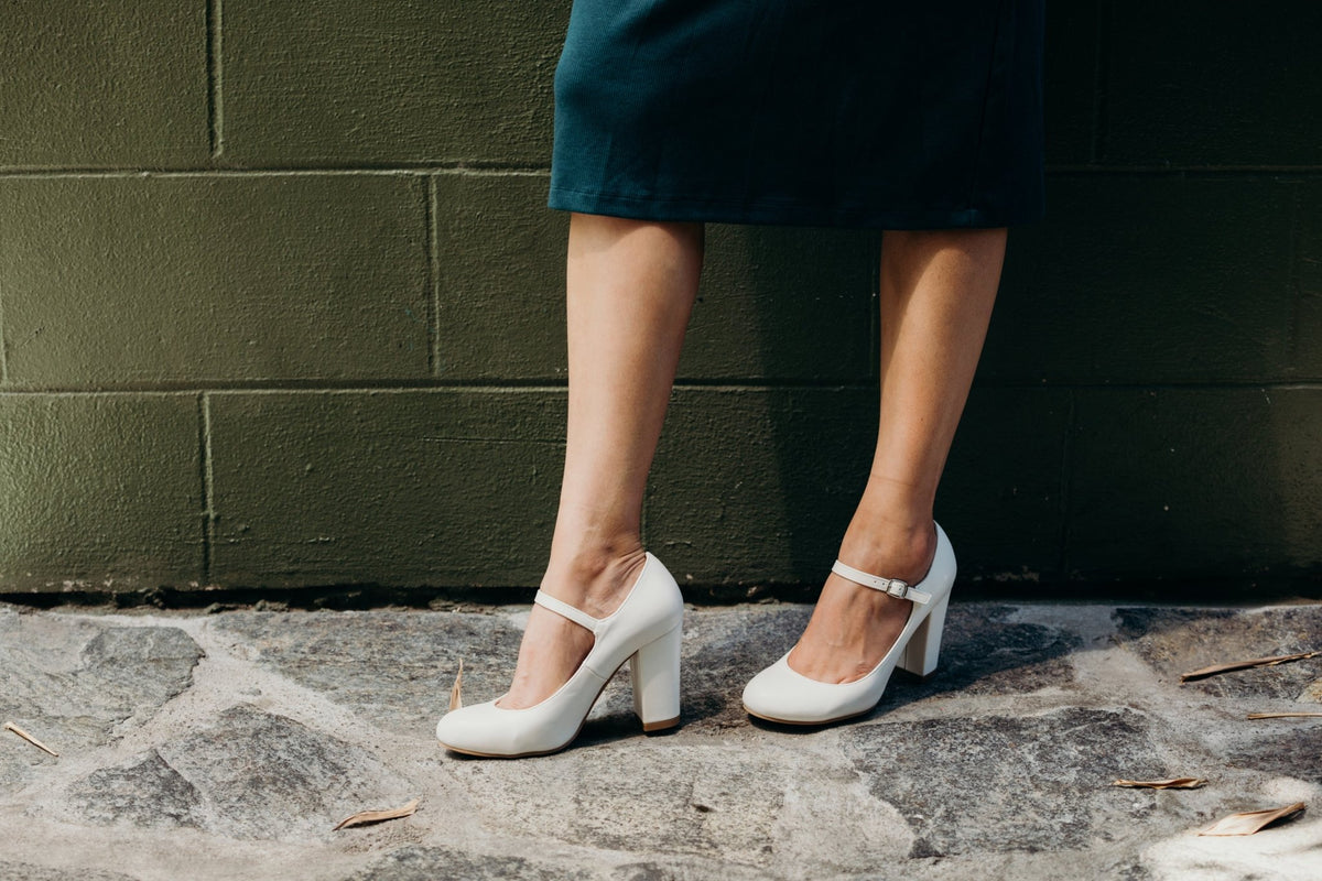 White Skippy Mary Janes worn with a dark skirt